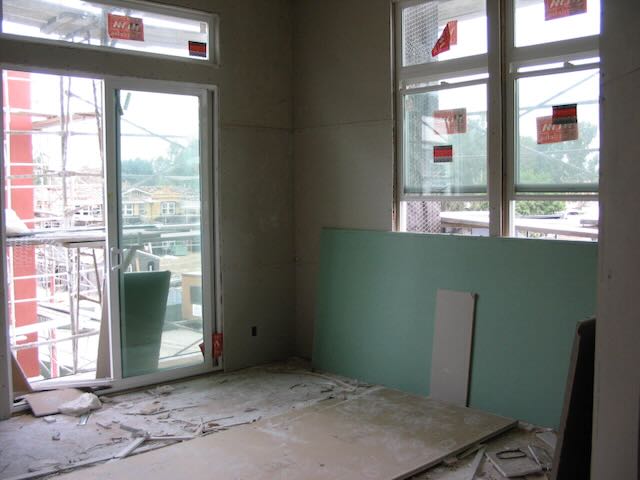 the main bedroom of an under-construction condo