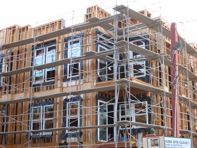 a building under construction surrounded by scaffolding