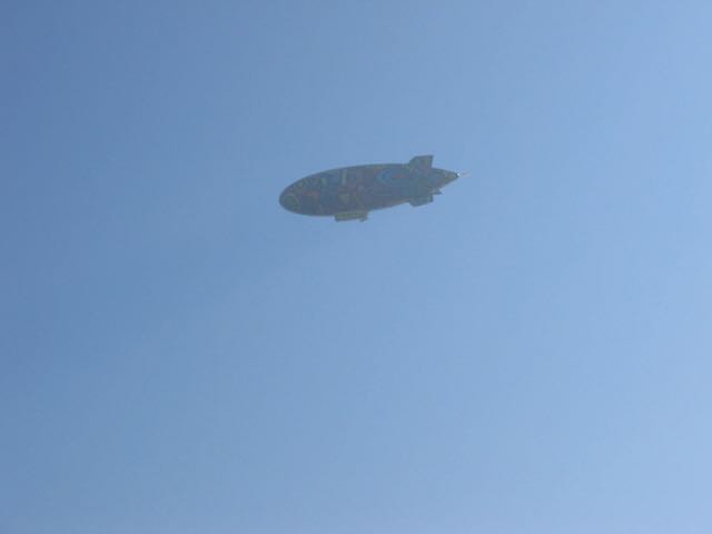 a bad picture of a multicolored blimp