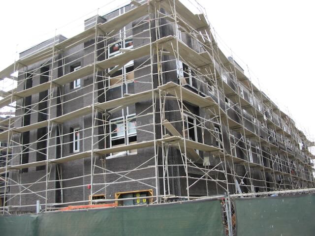 a building under construction surrounded by scaffolding
