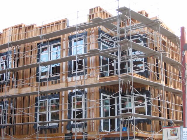 a building under construction surrounded by scaffolding