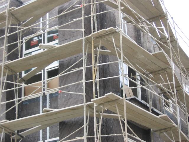 a building under construction surrounded by scaffolding