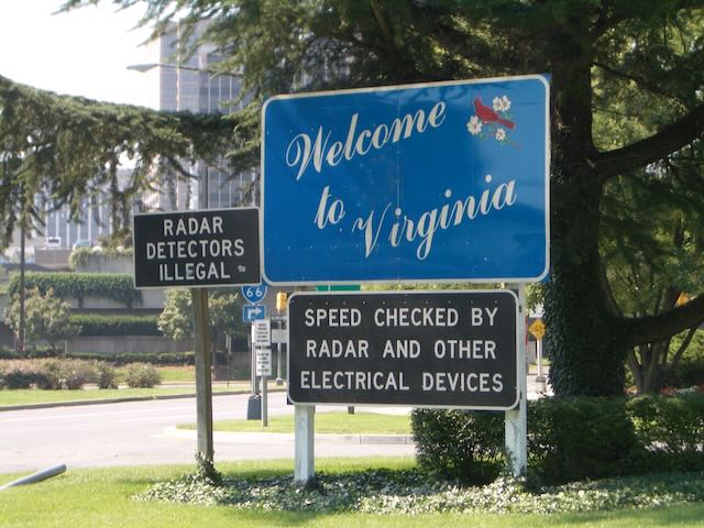 A sign reading Welcome to Virginia with additional signs about speed checks