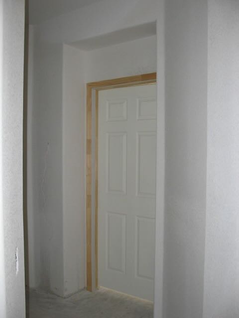 a closed door missing the trim around it