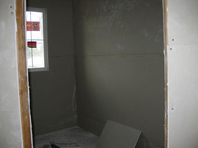 the walk-in closet of an under-construction condo