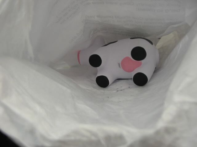 a squishy cow in a mailing envelope
