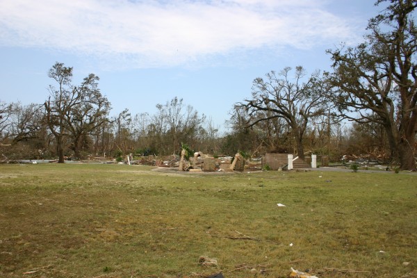 photo of the same yard, with only the front newel posts remaining