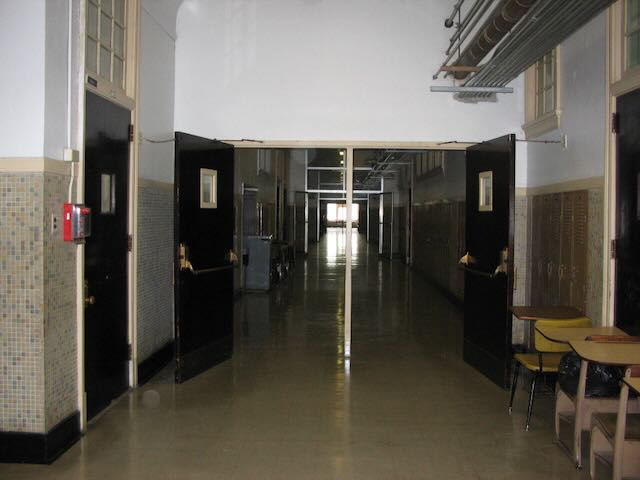 an unlit high school hallway