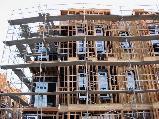 a building under construction surrounded by scaffolding