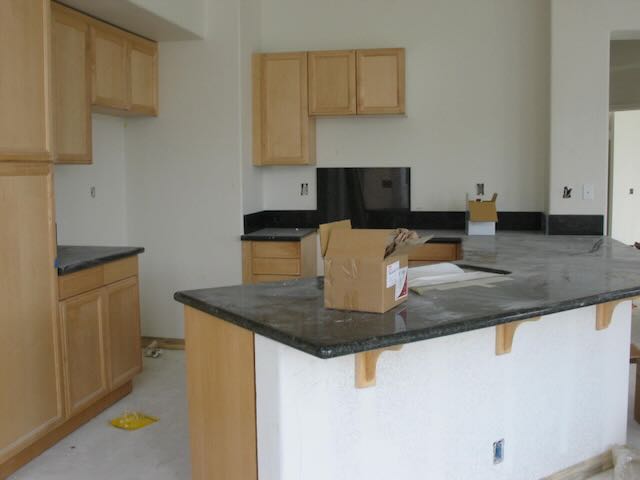 a kitchen with cabinets installed